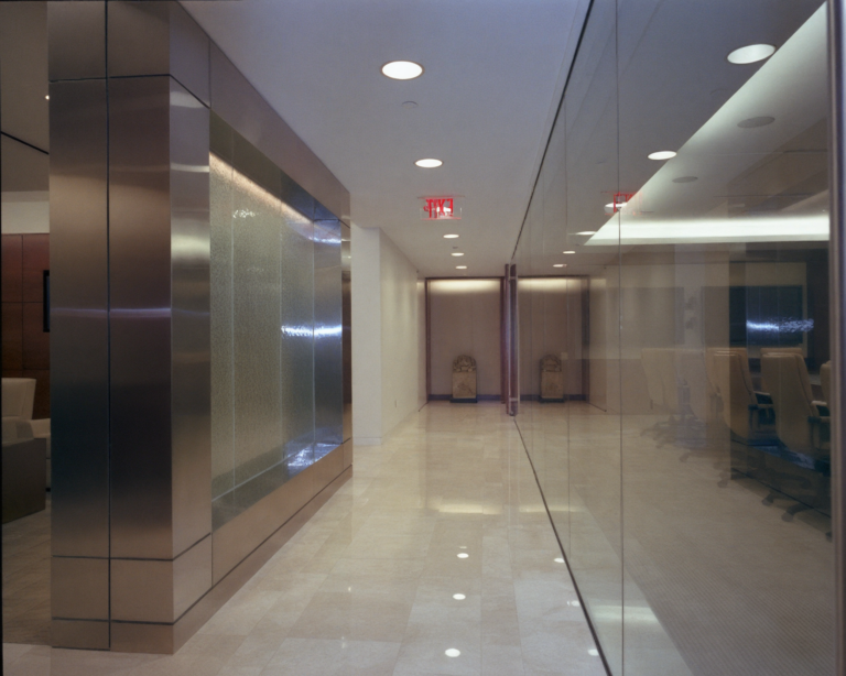 Law office hallway at Herrick Feinstein LLP completed by DDB Contracting, commercial interior contractor specializing in legal office tenant fit-outs.