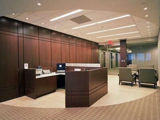 Renovated entrance area of Friedman Kaplan’s corporate law office in Newark, NJ featuring modern finishes, glass entry doors, and a sleek reception design by law office renovation contractor DDB Contracting