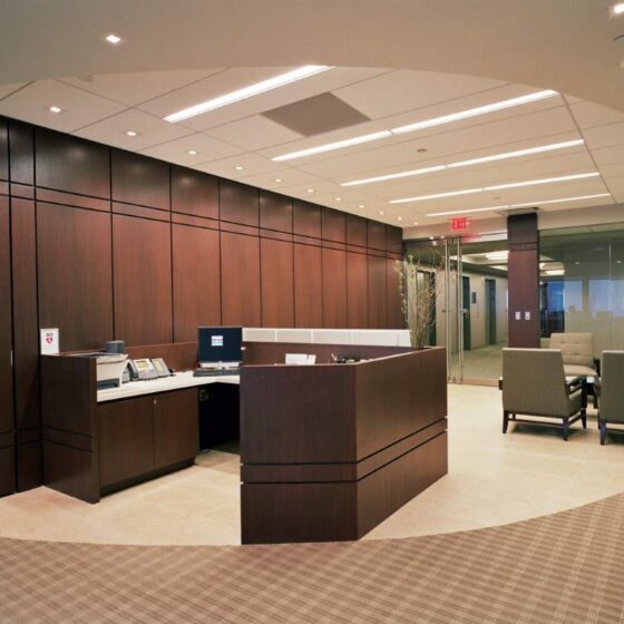 Renovated entrance area of Friedman Kaplan’s corporate law office in Newark, NJ featuring modern finishes, glass entry doors, and a sleek reception design by law office renovation contractor DDB Contracting