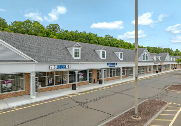 Exterior view of Sandhill Plaza, a retail shopping center in Newtown, Connecticut, undergoing renovation by DDB Contracting.